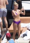 Hailey Baldwin in Purple Bikini enjoying a Boat Trip with Friends through Miami