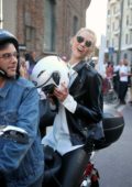 Karlie Kloss rides off on a motorcycle after walking the runway at Alberto Ferretti, spring summer 2018 during Milan Fashion Week, Italy