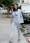 Olivia Munn in a baby blue suit arrives at The Daily Show in New York City