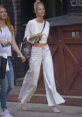 Michaela Kocianova wearing an all white ensemble while out shopping with friends in SoHo, New York City