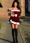 Chloe Khan wearing Santa dress while out with her dog in Liverpool, UK