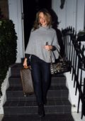 Elizabeth Hurley steps out with her Louis Vuitton as she head to the airport in London