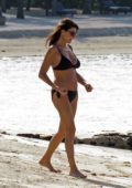 Ilaria D'Amico in a black bikini enjoying the beach in Mauritius