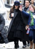 Keira Knightley wears a long grey coat with black dress while out for a stroll at the Sundance Film Festival in Park City, Utah