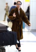 Alicia Vikander spotted wearing a comfy brown fur coat as she arrives at JFK airport in New York City