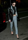 Bella Hadid wears a grey outfit with a leather jacket to a dinner with friends in New York City