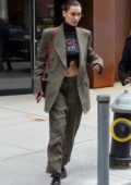 Bella Hadid wears an olive green suit as she leaves sister Gigi's apartment in New York City