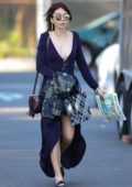 Sarah Hyland wears a blue long dress as she arrives to a party in Studio City, Los Angeles