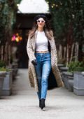 Victoria Justice keeps it chic in a leopard print trench coat and jeans while out with a friend in New York City