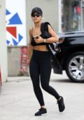 Rita Ora spotted in black sports bra, black leggings with matching black sneakers and hat as she stops by a medical office in Los Angeles