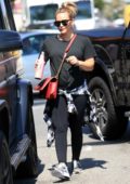 Hilary Duff dressed in all black seen leaving lunch with a friend in Los Angeles