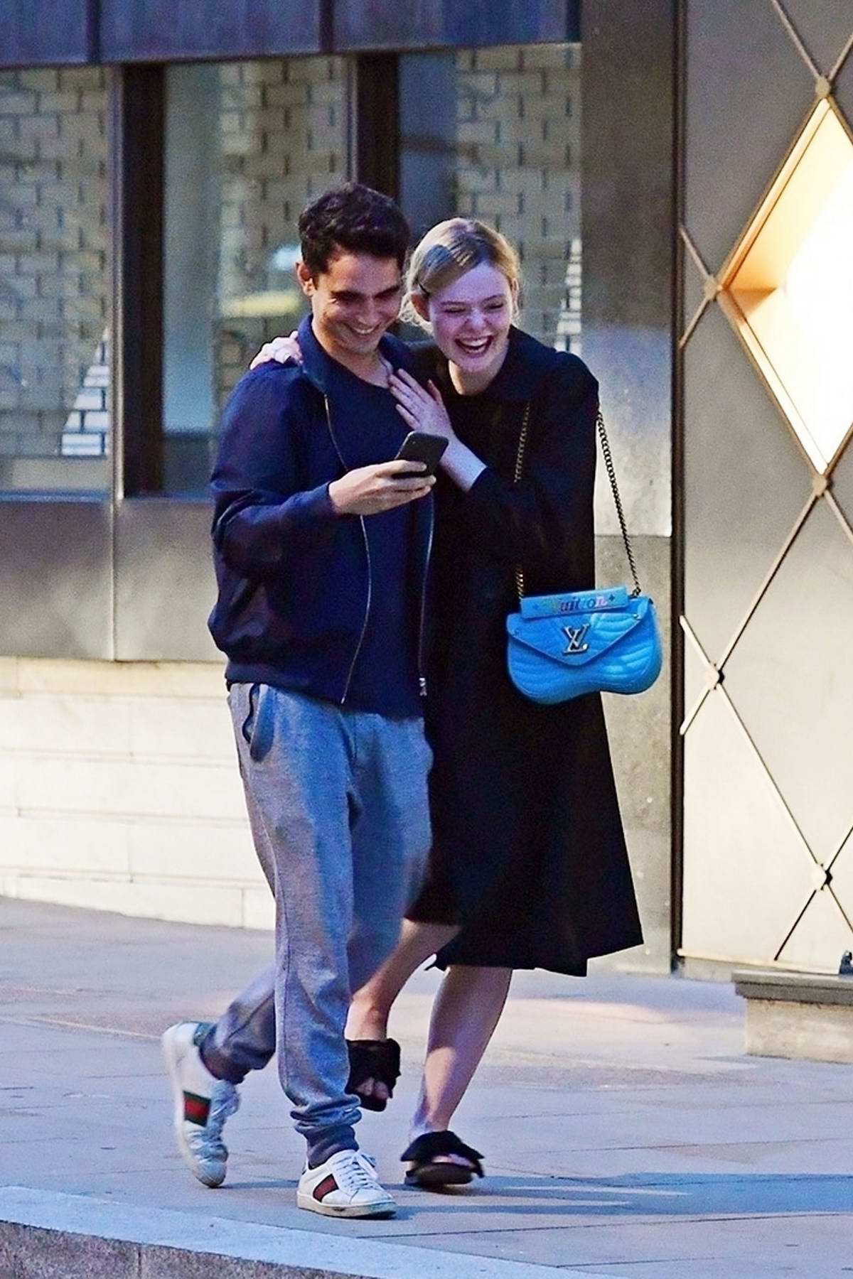 Elle Fanning and Max Minghella gets cozy while out in Mayfair, London, UK