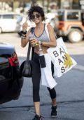 Sarah Hyland sips on some pre-workout drink as she heads in for a workout at her gym in Los Angeles
