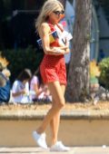 Charlotte McKinney looks cute in a red and white polka dot dress while out shopping with a friend in Malibu, California