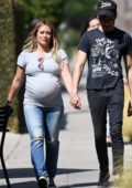 Hilary Duff wears a grey t-shirt and jeans while out for a stroll with boyfriend Matthew Koma in Los Angeles