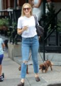 Kelly Rutherford is all smiles as she takes her dogs out for a stroll on a Starbucks coffee run in New York City