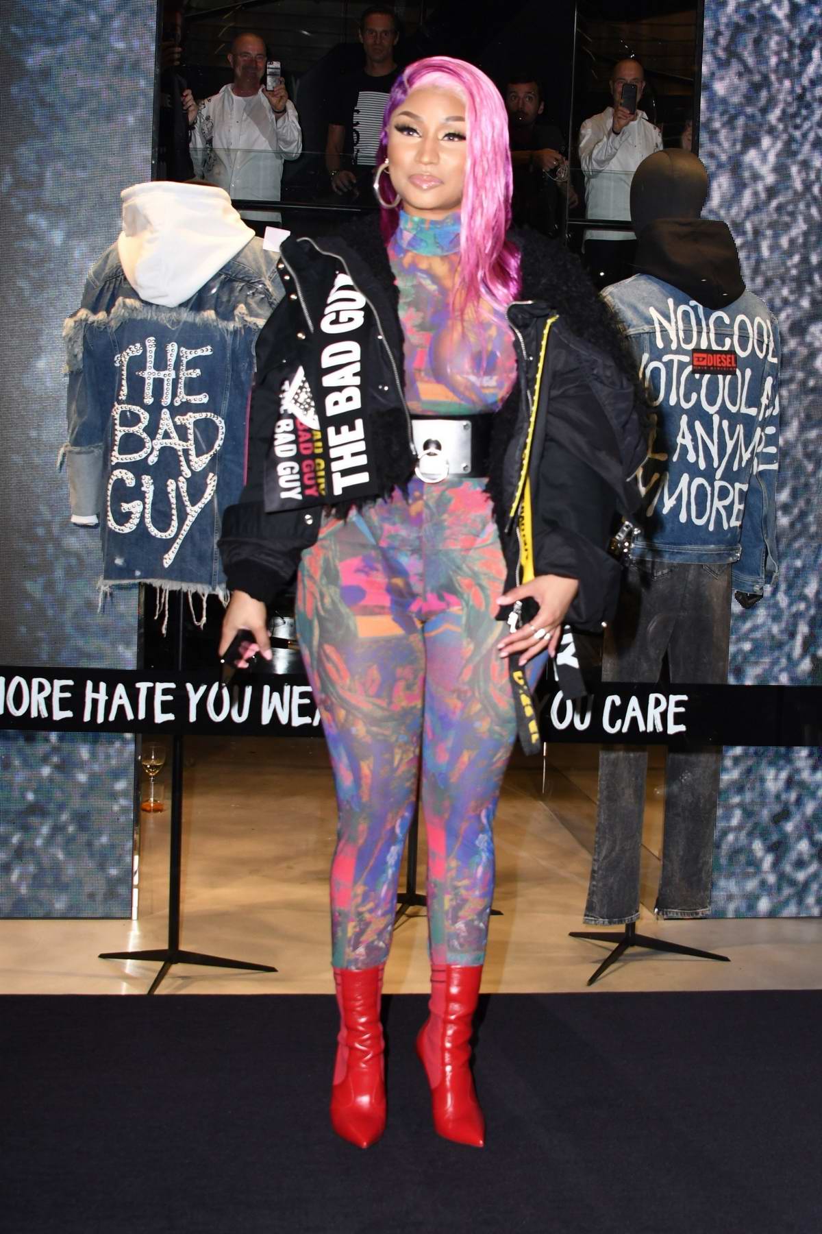 nicki minaj shows off her unique style in a colorful sheer jumpsuit as