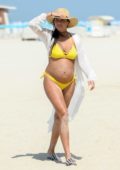Tyla Carr spotted in a yellow bikini while taking a shower after a stroll on the beach in Dubai, UAE