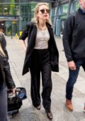 Amber Heard arrives at Heathrow airport to attend the premiere of her new movie 'Aquaman' in London, UK