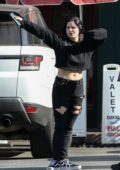 Ariel Winter opts for a cropped top and ripped jeans while out for lunch with Levi Meaden's parents in Sherman Oaks, Los Angeles