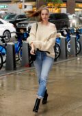 Barbara Palvin looks stunning in a cream sweater with rolled up jeans and black boots while visiting Victoria's Secret offices in New York City