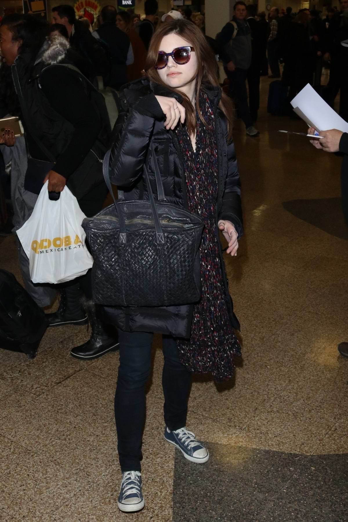 India Eisley arrives at Salt Lake City Airport for the Sundance Film Festival in Park City, Utah