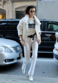 Bella Hadid rocks an 'Off White' sweater with an all white ensemble as she steps out in New York City