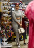 Jennifer Lopez looks sporty in a grey crop top with matching leggings while shopping at a candy store with her kids in Miami, Florida