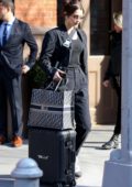 Bella Hadid seen leaving her apartment with her personalized luggage as she heads to the JFK airport in New York City