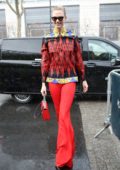 Karlie Kloss stands out in red as she arrives for the Off-White Show during PFW in Paris, France