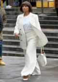 Kat Graham seen wearing a white pinstriped suit as she attends the United Nation Woman For Peace Luncheon in New York City