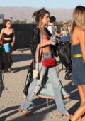 Alessandra Ambrosio spotted holding a drink as she walks into Coachella in Indio, California