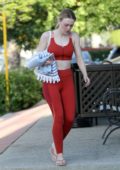 Dakota Fanning leaves the gym in a red sports bra with matching leggings after a grueling workout session in Los Angeles