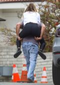 Sofia Richie wears a white tee and black leggings while out piggybacking on a friend in Malibu, California