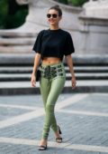 Victoria Justice looks chic in a black crop top and green skintight pants while out in New York City