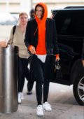 Zendaya arrives in a red hoodie at JFK Airport in New York City