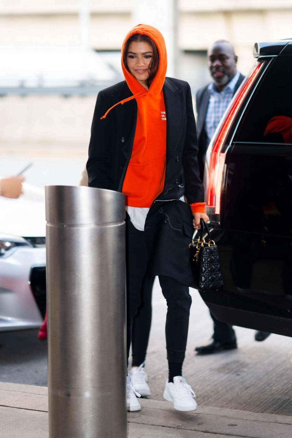 zendaya arrives in a red hoodie at jfk airport in new york city-250619_2