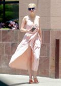 Amber Heard looked radiant in a light pink dress while stopping by a gas station in Los Angeles
