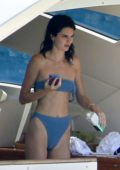 Kendall Jenner sports a blue bikini while relaxing on a yacht in Corsica, France