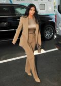 Kim Kardashian seen wearing a brown suit as she arrives at the White House in Washington D.C.