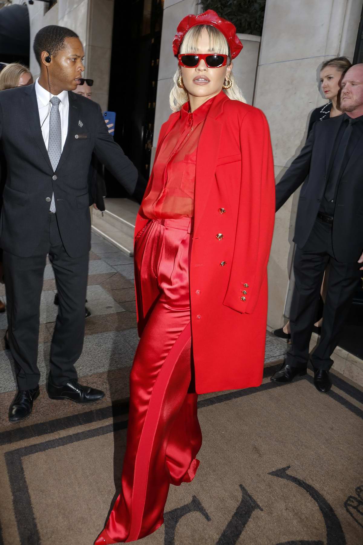 rita ora dazzles in an all red ensemble as she leaves her hotel during ...