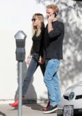 Miley Cyrus hold hands with Cody Simpson as they go out for lunch in Los Angeles