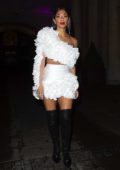 Nicole Scherzinger looks great in a white ruffle dress and thigh high black boots as she arrives at her hotel in London, UK