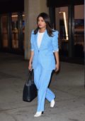 Priyanka Chopra wears an ice blue suit as she makes her way through the Newark Airport in New York
