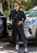 Katharine McPhee wears a long black coat, blue jeans while out on Valentine’s Day in West Hollywood, California