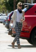 Portia de Rossi looks stylish in checkered pants as she heads to a warehouse in Los Angeles
