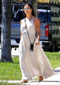 Eva Longoria wears a white maxi dress as she goes house hunting with husband Jose Baston in Beverly Hills, California