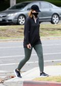 Katherine Schwarzenegger wears a face mask with an oversized shirt and leggings for an afternoon stroll in Santa Monica, California