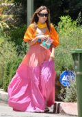 Olivia Wilde looks stunning in a colorful dress as she attends a birthday party with her daughter in Los Angeles