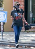 Ashley Benson wears a bandana mask as she stops to grab her morning coffee at Alfred's in West Hollywood, California